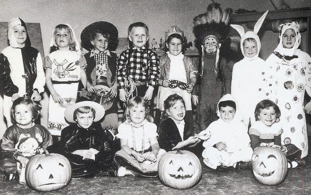 Group of kids in Halloween costumes in the early 1950s