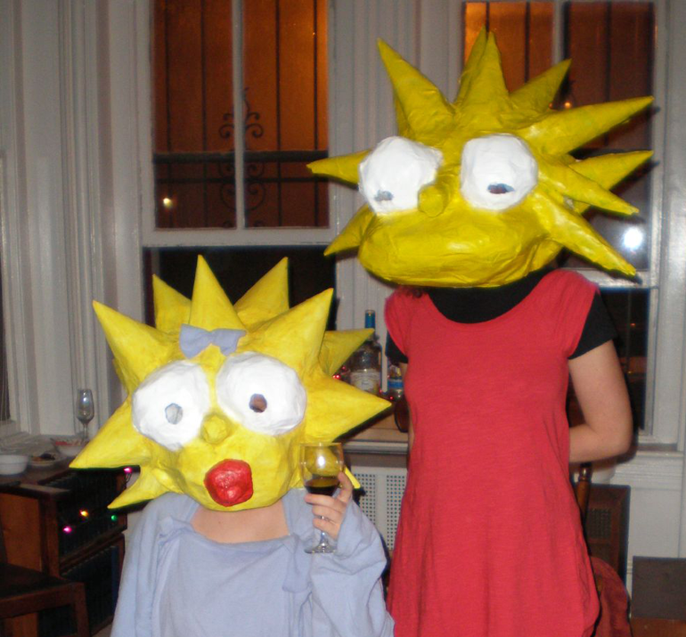Pair in Maggie and Lisa Simpson costumes at Halloween.